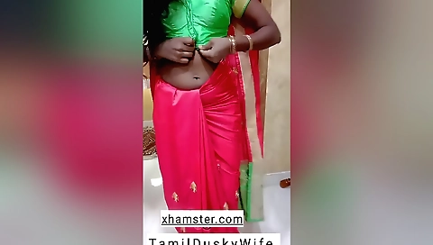 Indian housewife with a sexy body showing her boobs