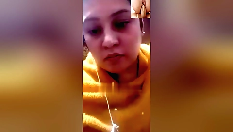 Hot brunette with large tits is masturbating on camera