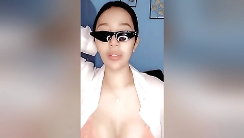 Indian brunette milf in a white bikini and a long dress solo video