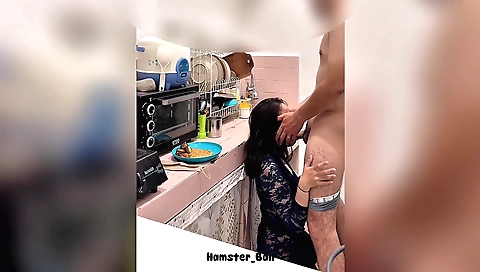 Hot brunette in the kitchen getting her dishes cleaned up