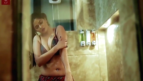 Big-titted brunette is fingering and rubbing her cunt