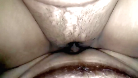 Asian brunette in black bikini sucking cock from behind