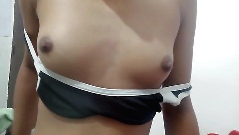 Hottie is stripping naked and fucking with her hands