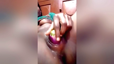 Indian brunette with a nice body has fun with her toy