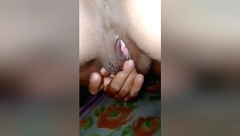 Indian girl is playing with her hair and hairdryer