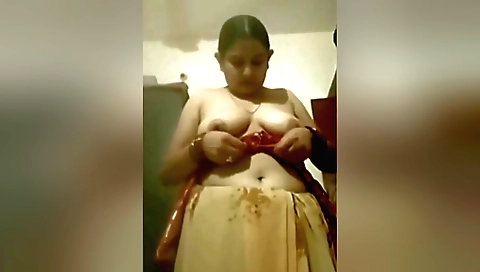 Indian brunette wearing red lingerie masturbates on web camera