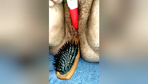 hairy blonde toy in a solo fetish scene on a couch