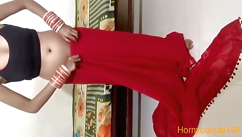 Indian brunette chick in a sexy dress plays with her hair