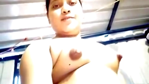 Busty brunette in a sexy topless outfit showing her body