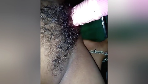 Horny solo female plays with a white dildo on a table
