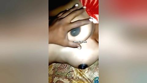 Indian girl is on her bed and she is pressing on her cunt