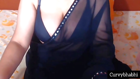 Bhabhi in a sexy black saree is playing with her big boobs