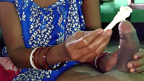 Indian babe on her bed in the kitchen playing with ice cream