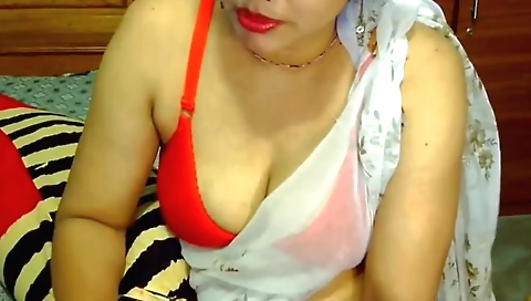 Indian brunette with big tits plays with her vibrator